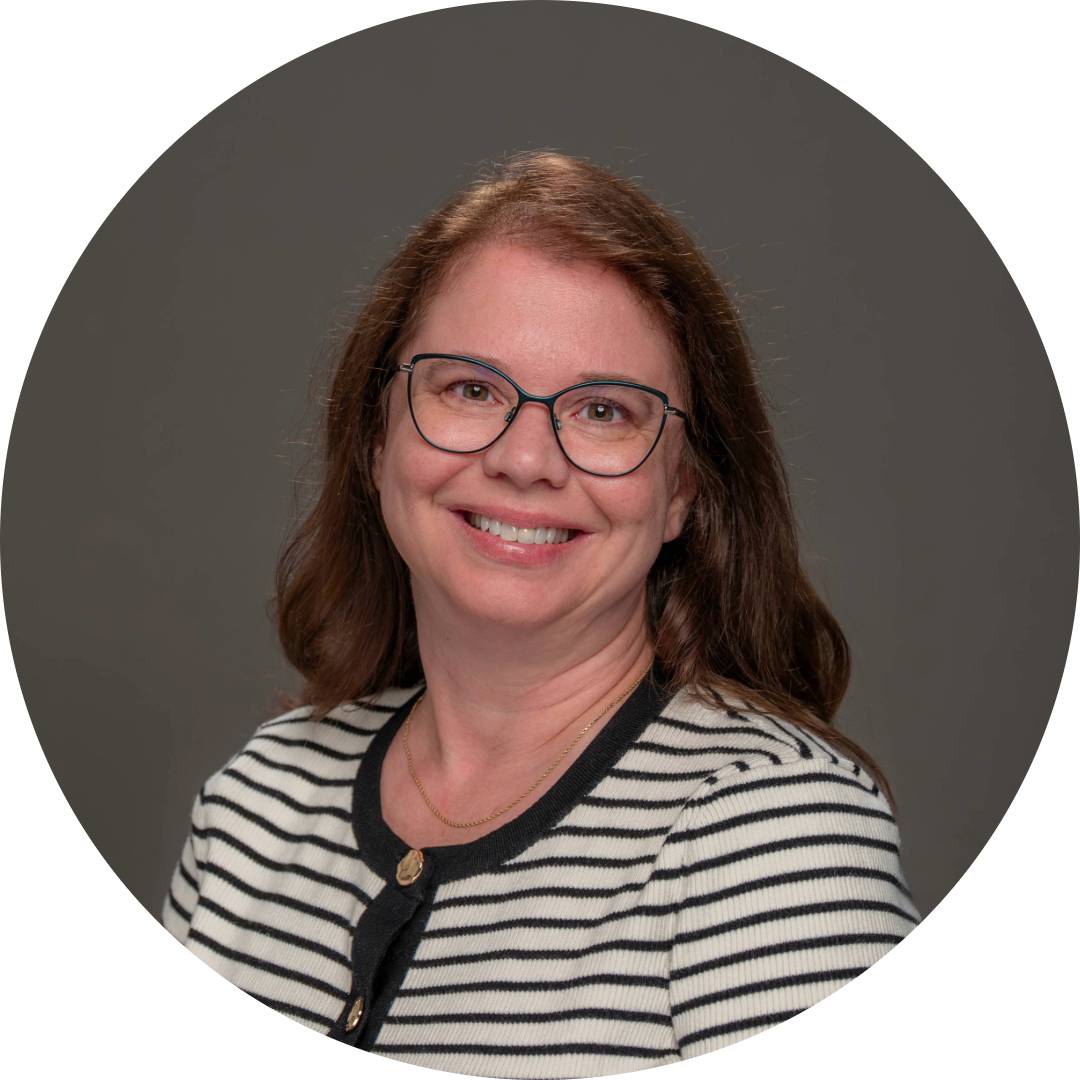 Anne Lewis smiling for her professional headshot